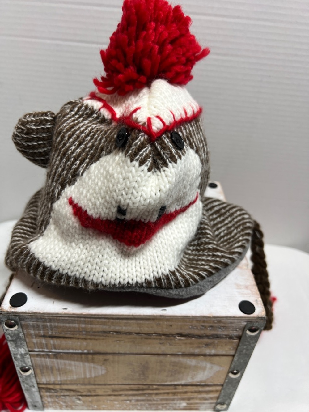 Brown and White Knitted Sock Monkey Hat with Red Pom
